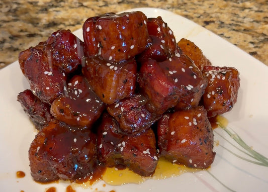 Asian Bang pork belly burnt ends coated in a sticky sweet and savory glaze