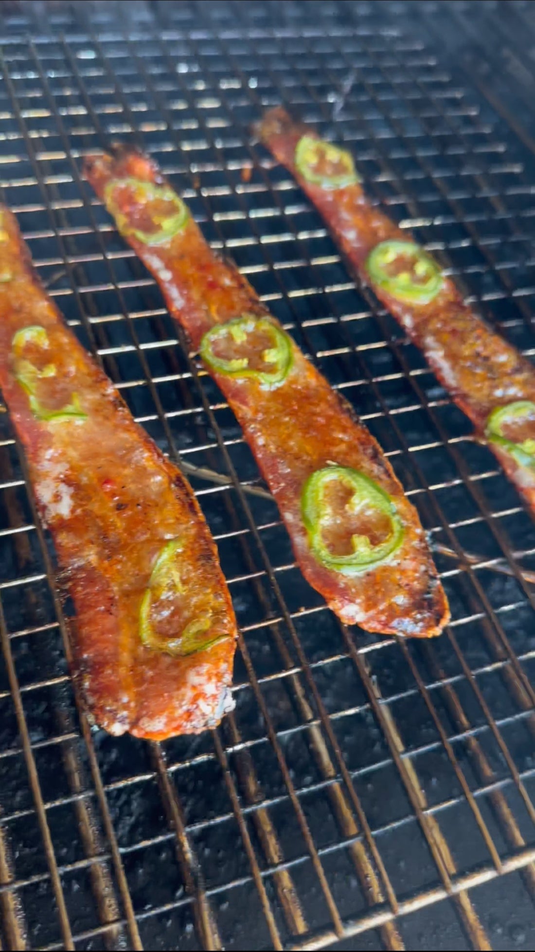 Scorpion candied bacon with hot honey and fresh jalapeno slices