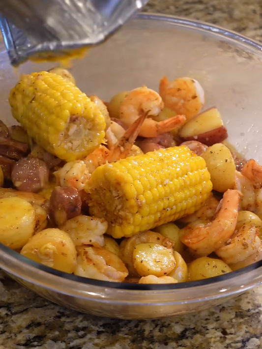 Grilled Cajun honey butter shrimp boil with sausage corn and potatoes
