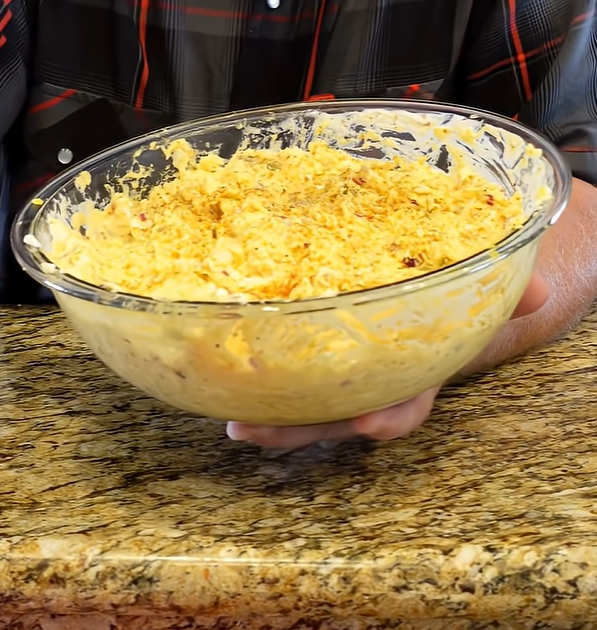 Creamy potato salad with eggs red onion and dill pickles