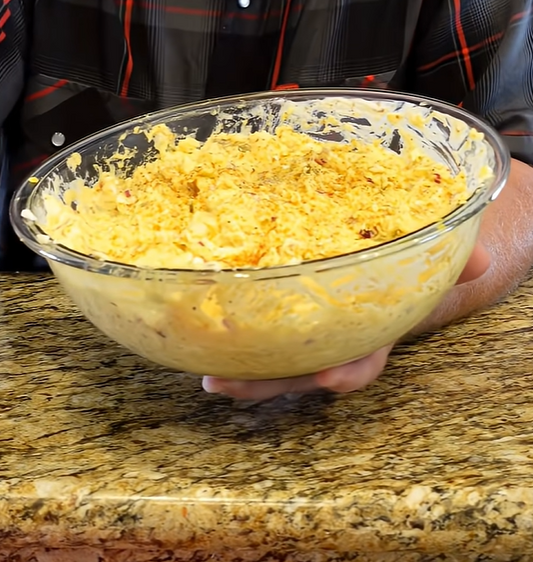 Creamy potato salad with eggs red onion and dill pickles