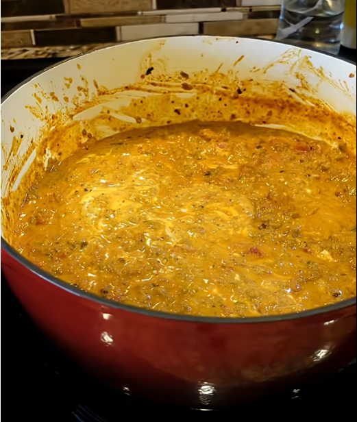 Homemade Chili Queso Dip with seasoned beef, jalapeños and melted cheese