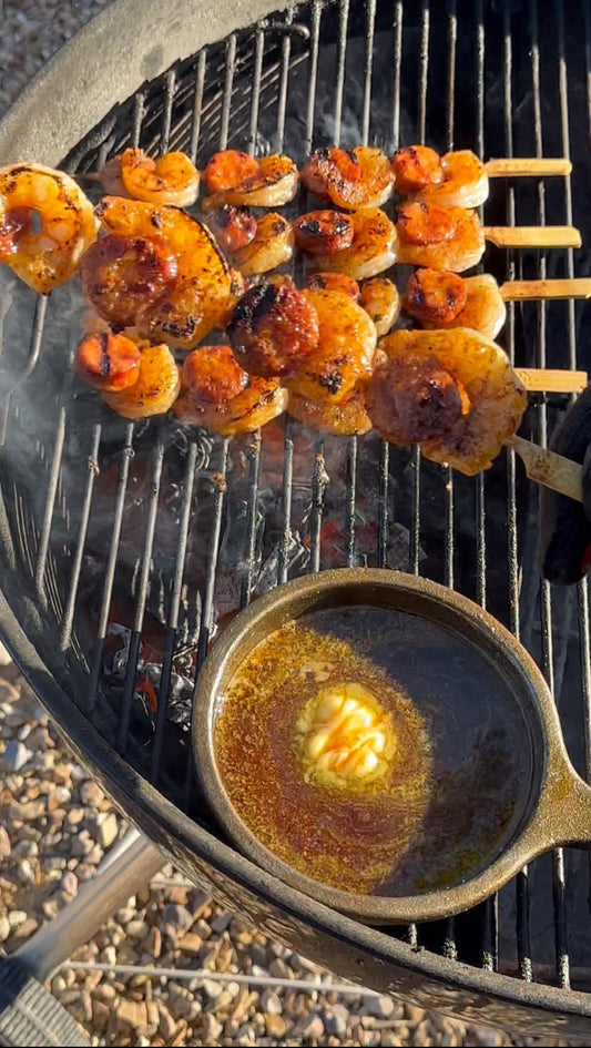 Grilled Cajun shrimp and andouille sausage skewers with hot honey butter