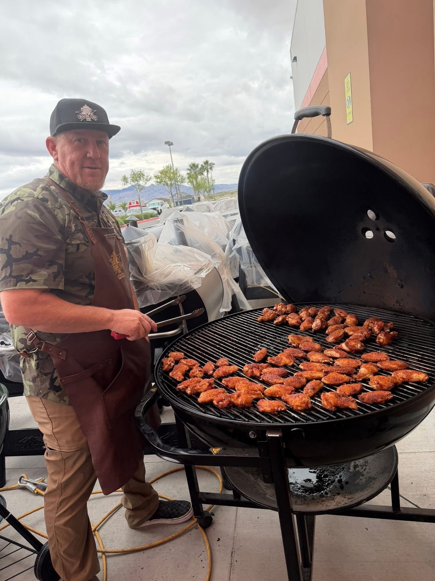 Mike Starr Cooking On A Grill With Blazing Star BBQ